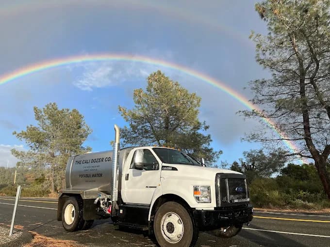 The Cali Dozer Co water delivery truck with rainbow